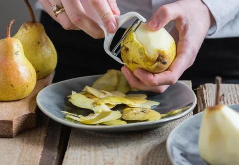 Peeling pears Stock Photos