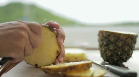 Peeling a pineapple Stock Footage 12139323