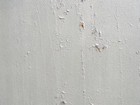 Peeling plaster texture. Wall with peeling plaster. Full screen image. Gray Stock Photos
