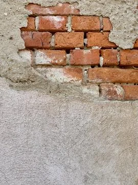 Peeling Plaster Wall With Exposed Red Brick Texture Stock Photos