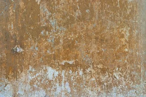Peeling plaster wall with layered paint texture Stock Photos