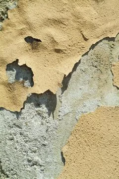 Peeling plaster of a wall Stock Photos