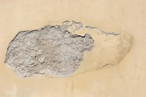 Peeling plaster on the wall. Stock Photos