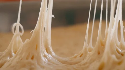 Peeling Plastic Wrap Off Risen Bread Dough Stock Footage 129559188