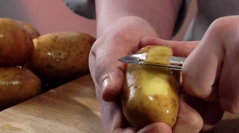 Peeling a potato Stock Footage 8573636