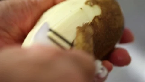 Peeling a Potato Stock Footage 75212275