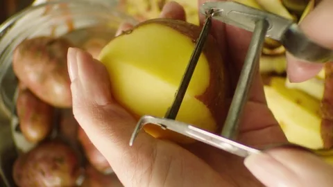 Peeling potato Stock Footage 76991587
