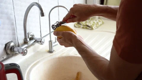 Peeling off potato in the kitchen Stock Footage 117279776