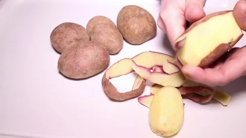 Peeling Potatoes Stock Footage 73423347