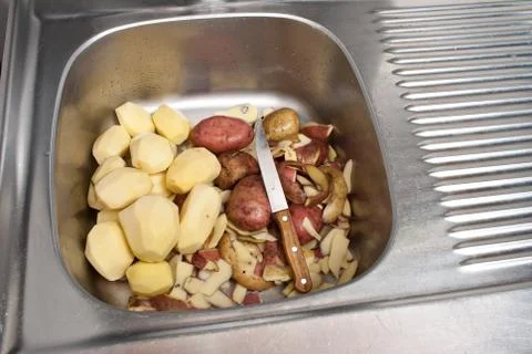 Peeling potatoes Stock Photos