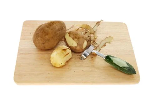 Peeling potatoes Stock Photos