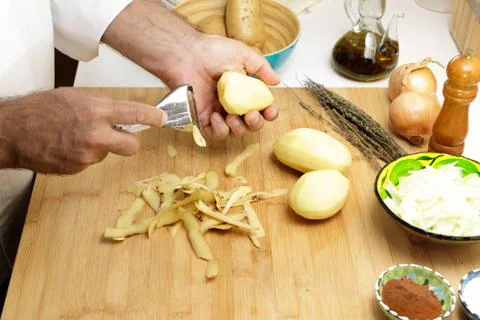 Peeling potatoes Stock Photos
