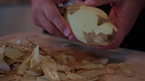 Peeling Potatoes with Precision Video stock 325222826