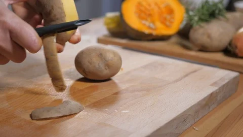 Peeling potatoes zoom Stock Footage 104554940