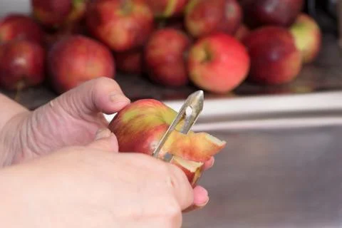 Peeling red apples Stock Photos