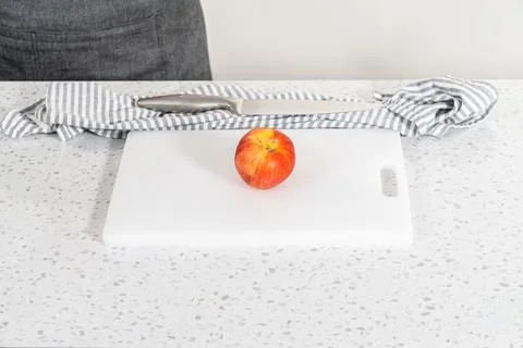 Peeling red apples Stock Photos