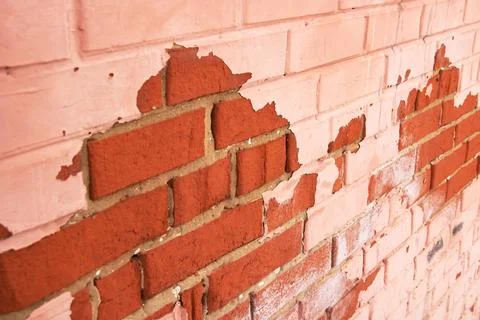 Peeling red paint on brick wall, background or texture Stock Photos