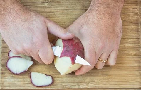 Peeling a Red Potato Stock Photos