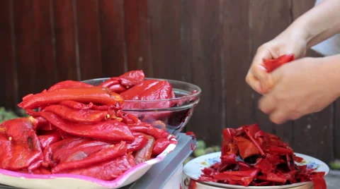 Peeling Roasted Red Peppers, CloseUp Stock Footage 56797535