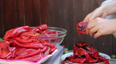 Peeling Roasted Red Peppers, CloseUp Stock Footage 56797571
