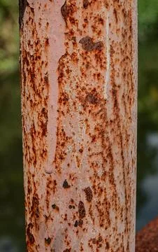 Peeling rust layer on industrial vertical pipe Stock Photos