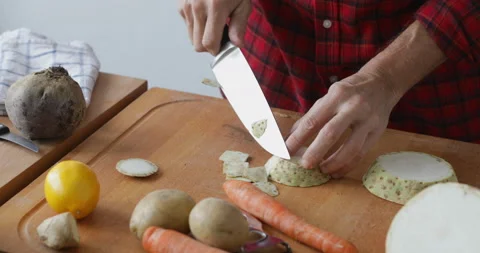 Peeling slice of celery root, close up Stock Footage 146242983
