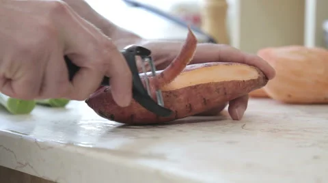 Peeling sweet potato Stock Footage 58856345