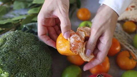 Peeling a tangerine Stock Footage 276896527