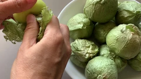 Peeling Tomatillo Husk Stock Footage 134380986