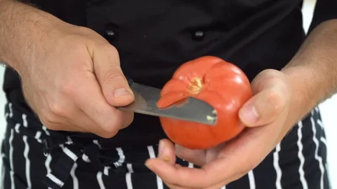 Peeling tomato in the kitchen, ib01 Stock-Footage 109123236