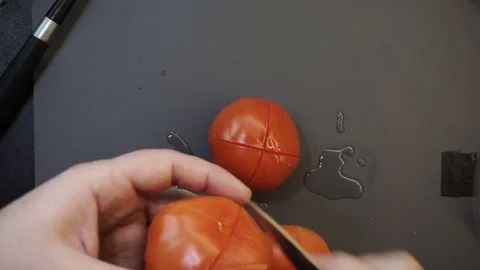 Peeling tomatoes overhead Stock Footage 121118309