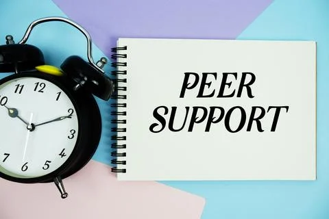 Peer Support text written on notepad with alarm clock flat lay on multicolo.. Stock Photos