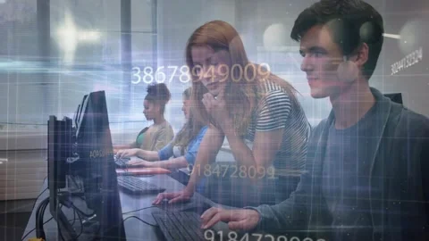 Peer tutor in computer lab tapping keyboard and causing data overlay across Stock Footage 321783346
