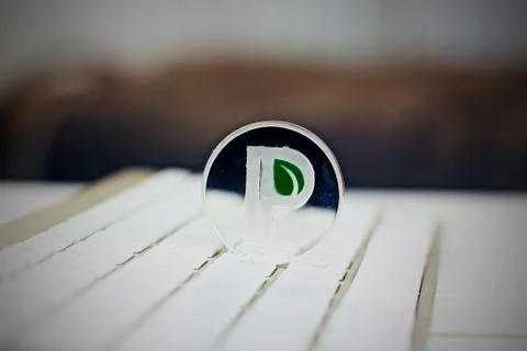 Peercoin on the white keyboard Stock Photos