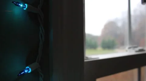 Peering out a window at Christmas time Stock Footage 44447890
