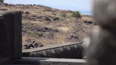 Peering Through Rubble of Synagogue at Arid Landscape Stock Footage 78547852