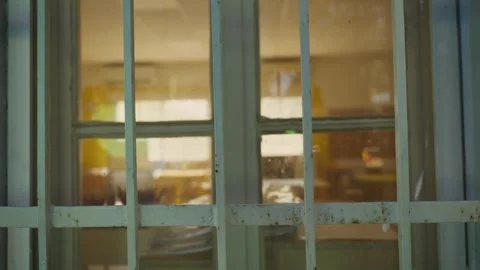 Peering Through School Window into Vacant Classroom Stock Footage 320451399