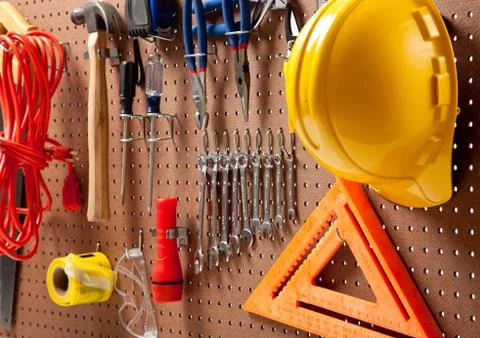 Peg board with tools and hard hat Stock Photos