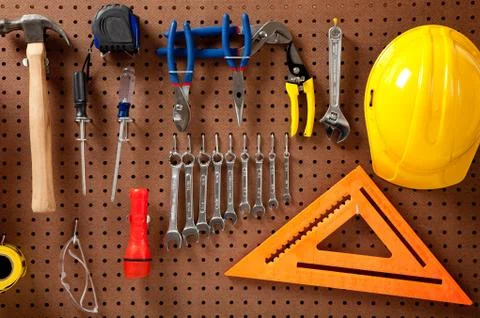Peg board with tools and hard hat Stock Photos