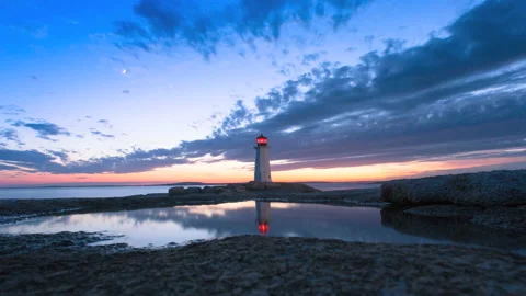 Peggy's Cove Lighthouse during the blue hour Atlantic Coast Nova Scotia Canada Stock Footage