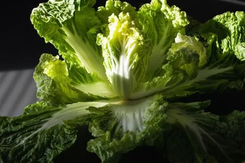 Peking cabbage in a wooden box on a rustic background. Diet proper nutrition. Stock Photos