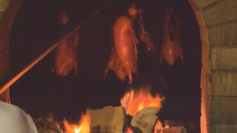 Peking duck being roasted in hung oven, Beijing, China Stock Footage 99460483