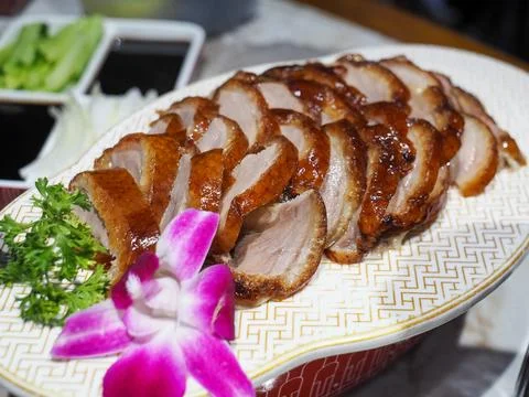 Peking Duck on a chinese pattern ceramic plate.. Stock Photos
