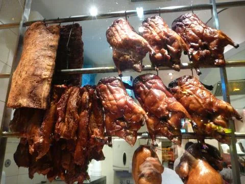 Peking ducks in window Stock Photos