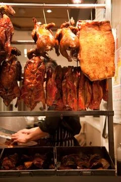 Peking ducks in window Stock Photos