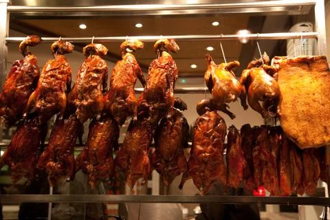 Peking ducks in window Stock Photos