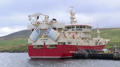 Pelagic trawler moored at Collafirth pier in the north of Shetland Stock Footage 77569740