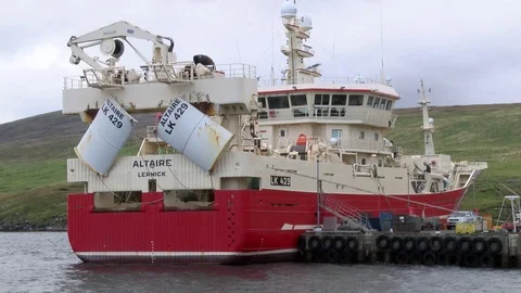 Pelagic trawler moored at Collafirth pier in the north of Shetland Stock Footage 77569833
