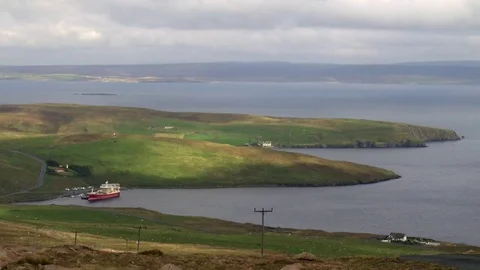 Pelagic trawler moored at Collafirth pier in the north of Shetland Stock Footage