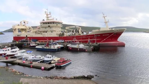 Pelagic trawler moored at Collafirth pier in the north of Shetland Stock Footage 77569855